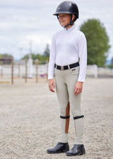 Child wearing the shirt while engaging in outdoor activities, showcasing its versatility