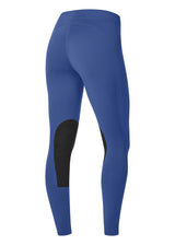 Flat lay of the Kerrits Flow Rise Knee Patch Performance Tight, showing the back profile and ergonomic seaming.