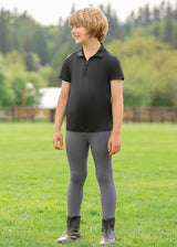 Child wearing the shirt while engaging in outdoor activities, showcasing its versatility